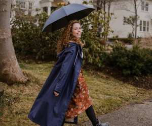 Someone wearing the Midnight Blue Mernini raincoat