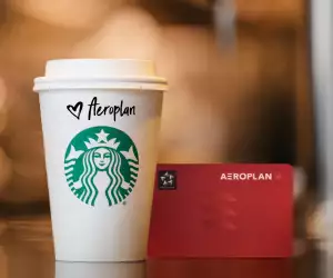 Aeroplan points partners with Starbucks Rewards | A Starbucks coffee next to an Aeroplan card