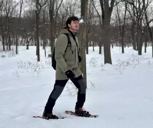Escapism's Hunter Gutman walking through the Montréal forest wearing Columbia's Landroamer Collection