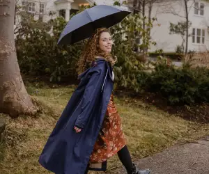 Someone wearing the Midnight Blue Mernini raincoat